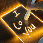 Neon sign with 'I love you' text on a wooden background