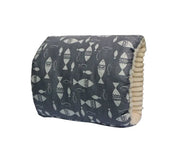 Folded blanket with a fish pattern on a white background