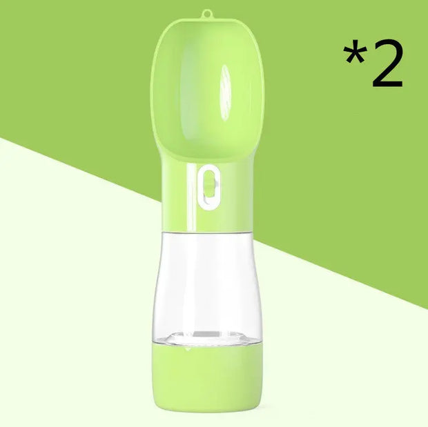 Traveling Out Portable Dog Water Dispenser in green with water cup and food container for pets on the go.