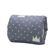 Folded blanket with crown pattern on a white background