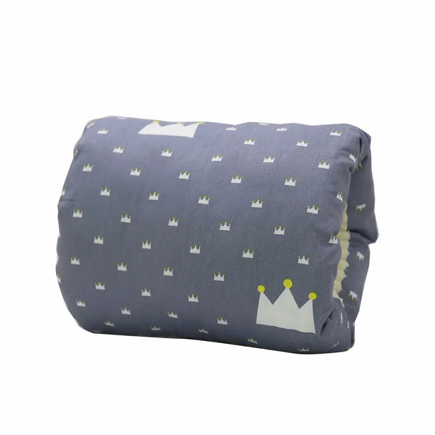 Folded blanket with crown pattern on a white background