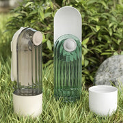 Three cylindrical devices on grass with a natural background