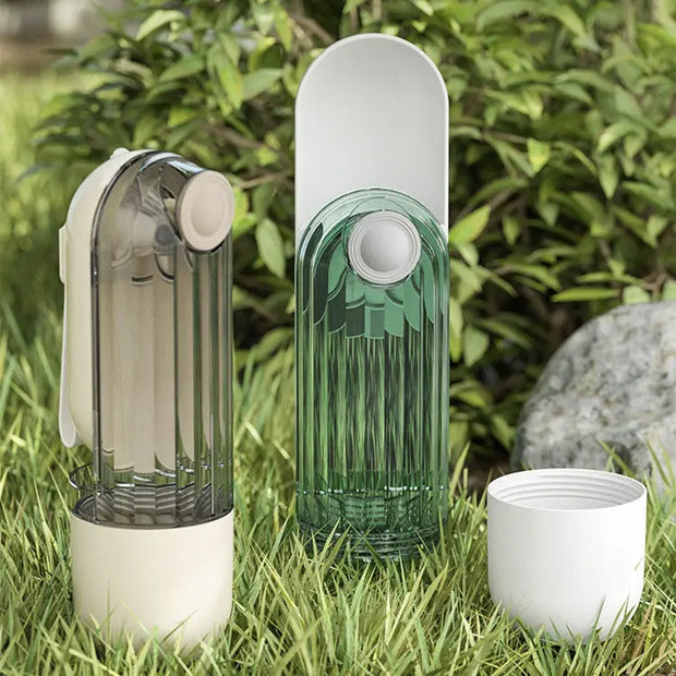 Three cylindrical devices on grass with a natural background