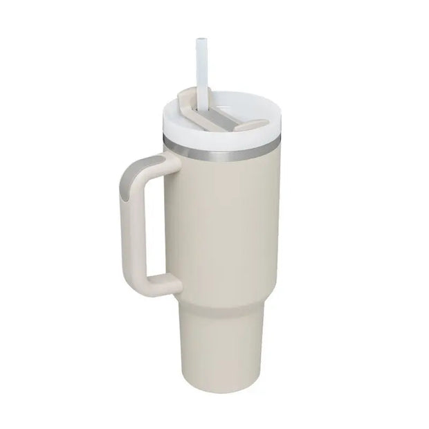 Beige insulated mug with handle and straw lid on a white background