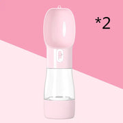 Traveling Out Portable Dog Water Dispenser in pink with dual compartments for water and food, leak-proof design.