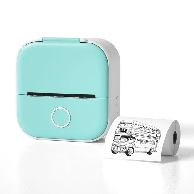 Mint green portable printer with a printed roll of paper featuring a bus design on a white background