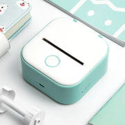 Portable Mini Thermal Label Printer Home Photo Printer Student Wrong Question Printer Bluetooth-compatible Mini Label Printer Price Tag in white and teal color on desk.