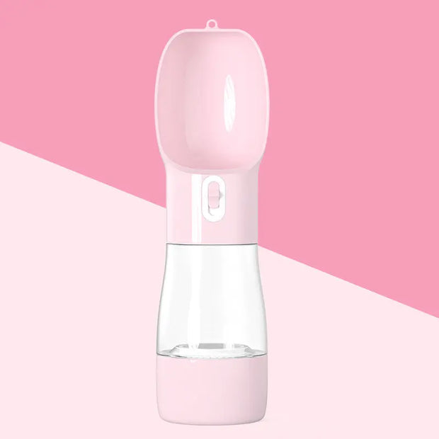 Traveling Out Portable Dog Water Dispenser in pink with water cup and food container for pets on the go.