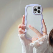 Person holding a phone case with a light purple border