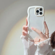 Person holding a phone case with a wavy design