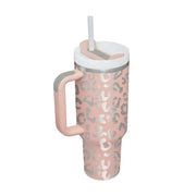 Pink tumbler with leopard print pattern on a white background