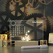 Transparent calendar with floral design on a dark background with gears and wooden blocks.