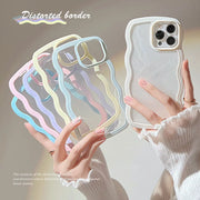 Transparent phone case with colorful border held by a hand against a neutral background