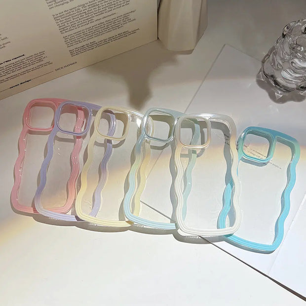 Five transparent phone cases with colorful edges on a white surface.